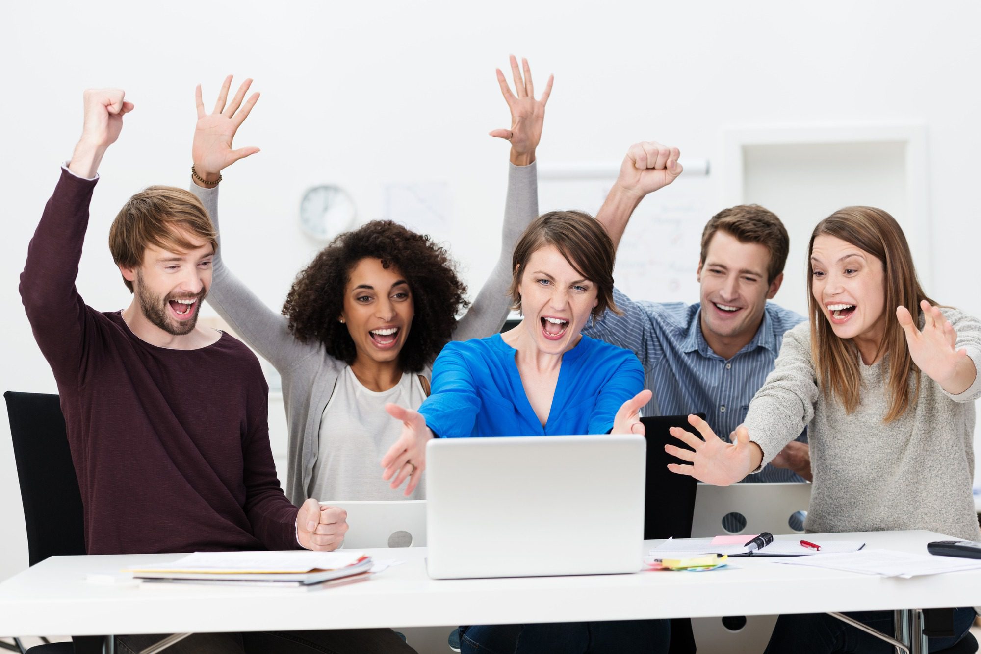 Excited successful business team cheering
